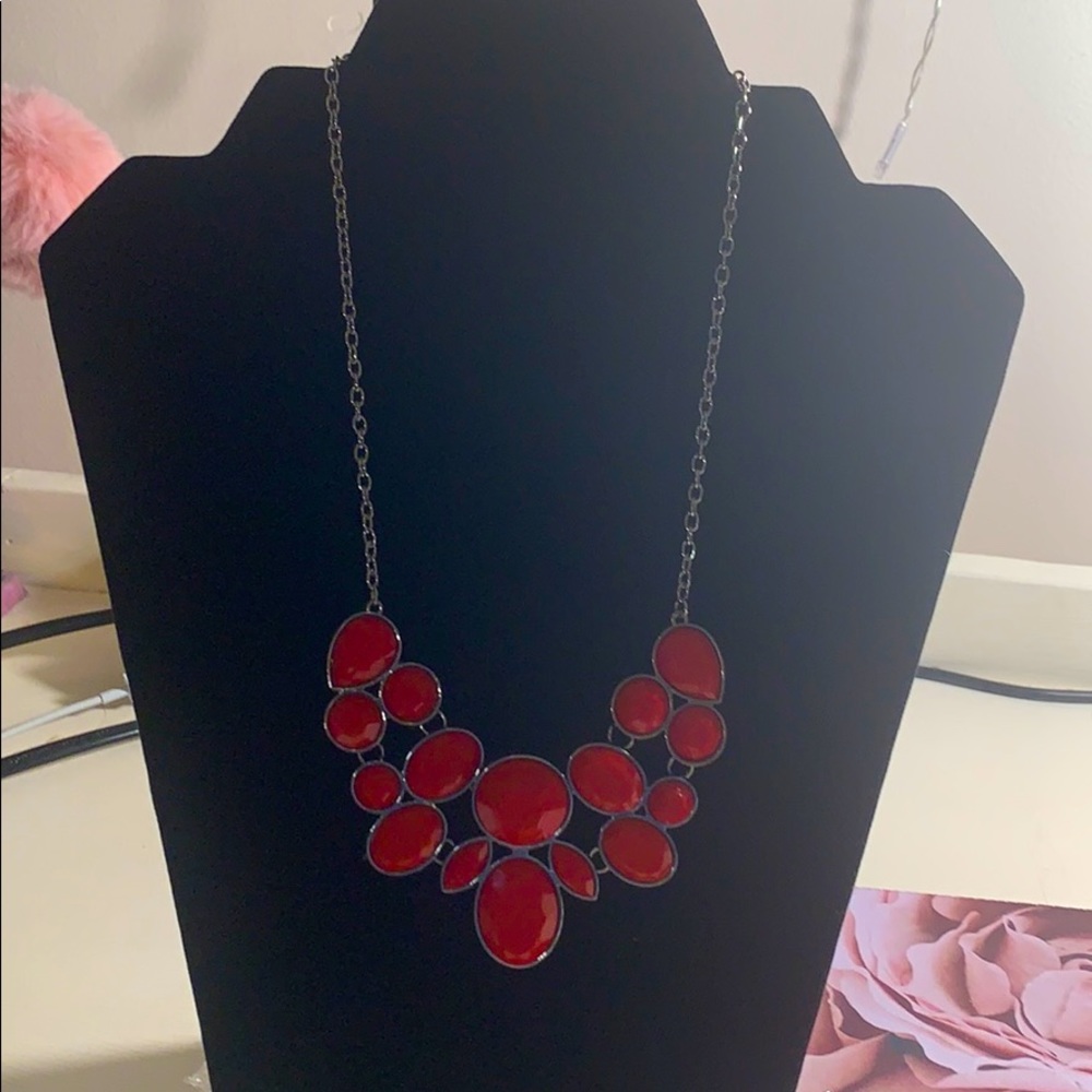 A red necklace with a matching pair of earrings ❤️